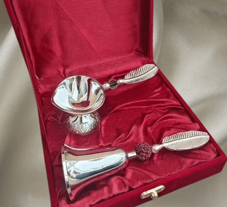 Luxurious German Silver Plated Pooja Bell (Ghanti) and Diya (Oil Lamp) set, presented in a red velvet gift box, perfect for Diwali or Hindu wedding return gifts.